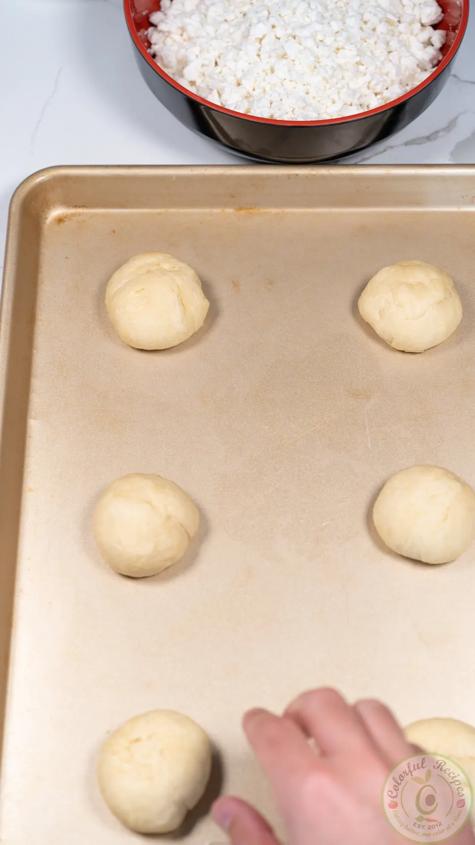 Manakish dough balls on a tray