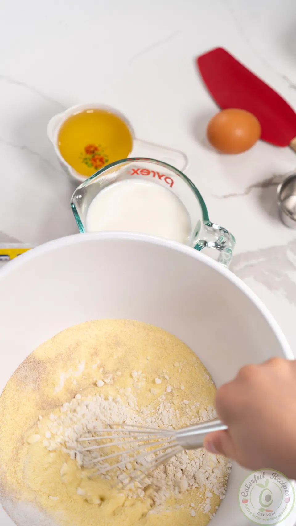 Whisking manakish dry ingredients