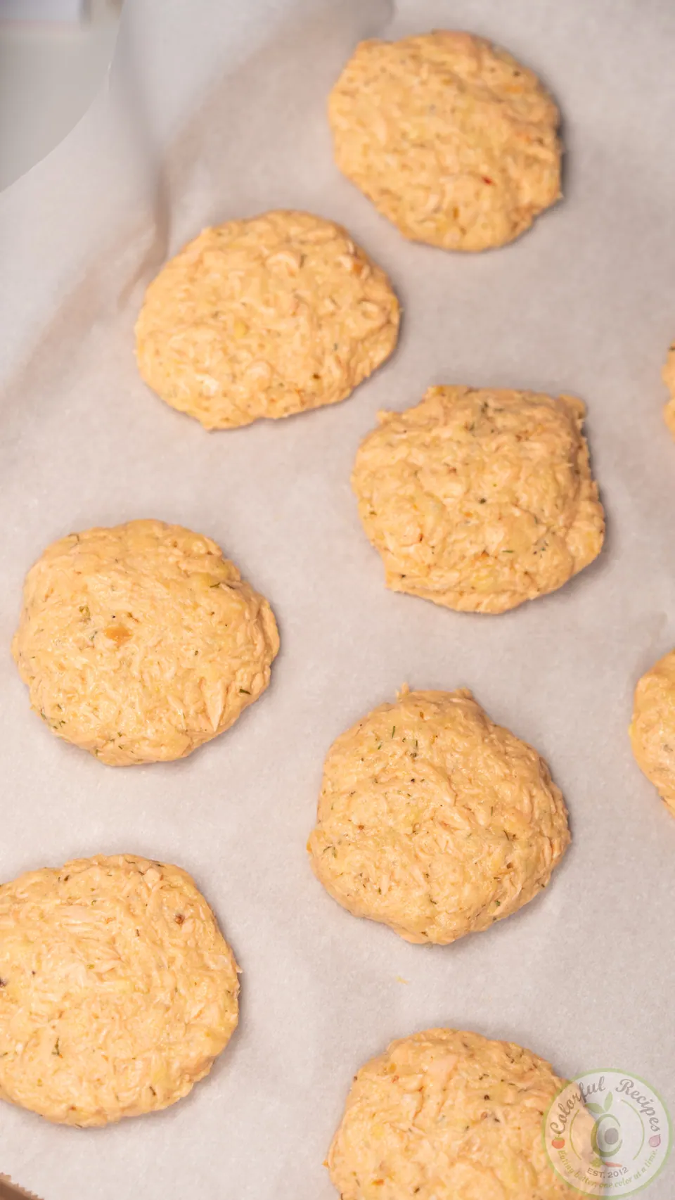 Uncooked salmon patties on parchment