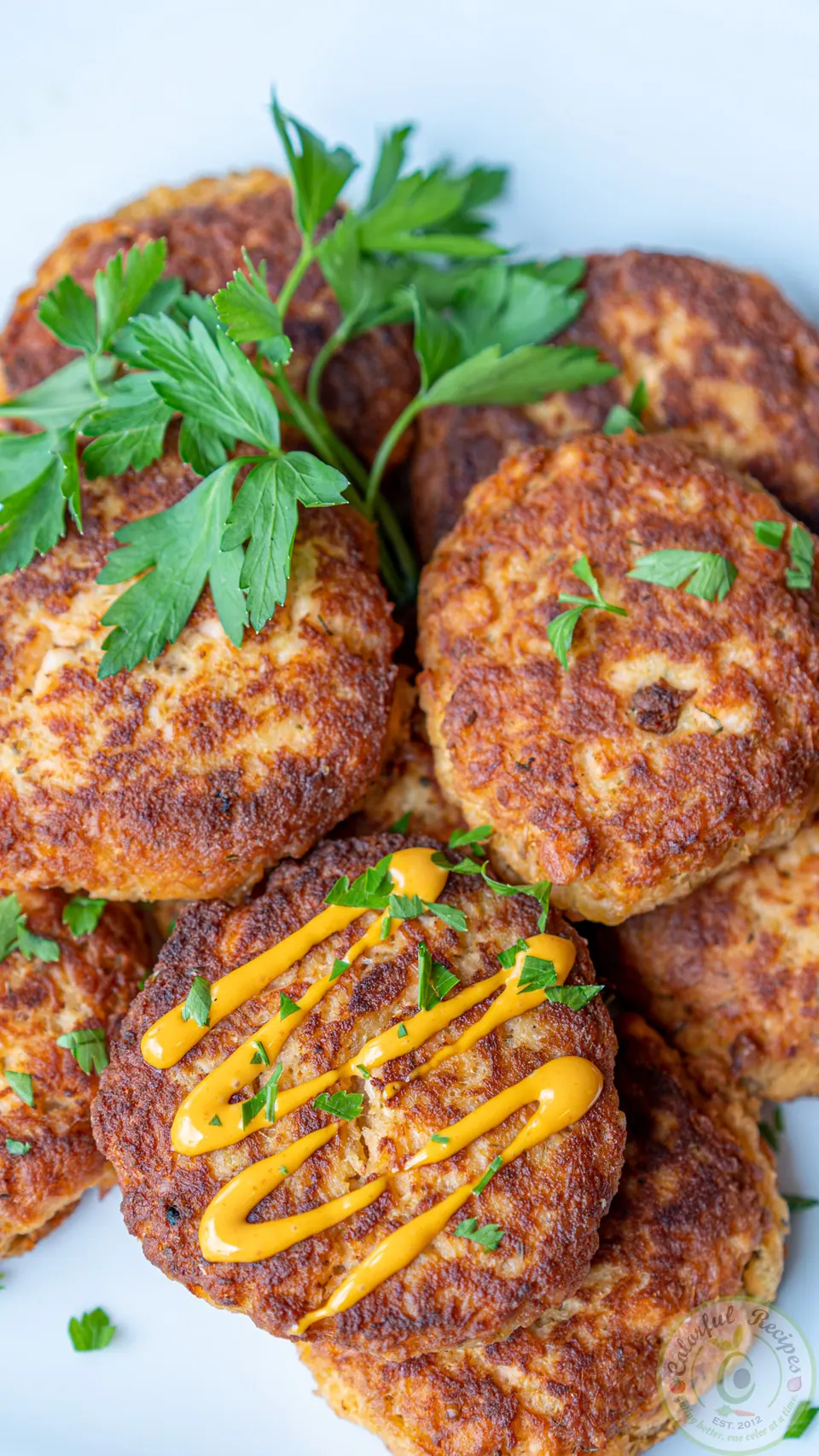 Salmon patties with sriracha mayo and parsley