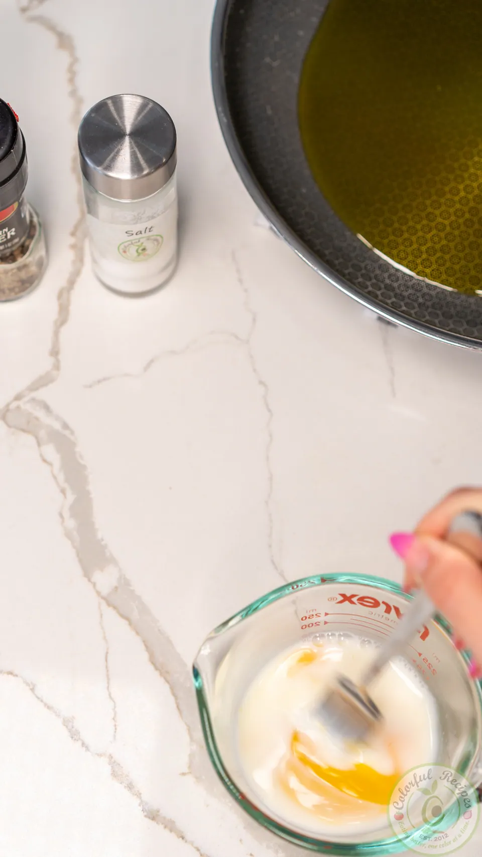 Whisking eggs and milk for salmon patties