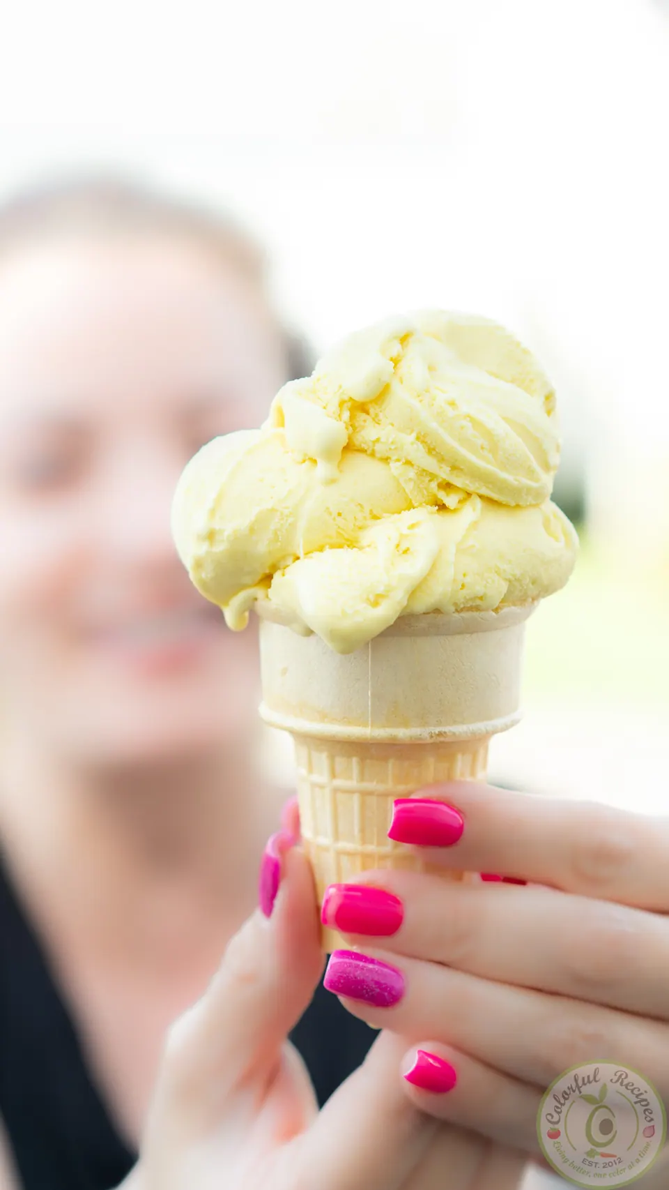 Holding a cone of golden spice turmeric ginger ice cream