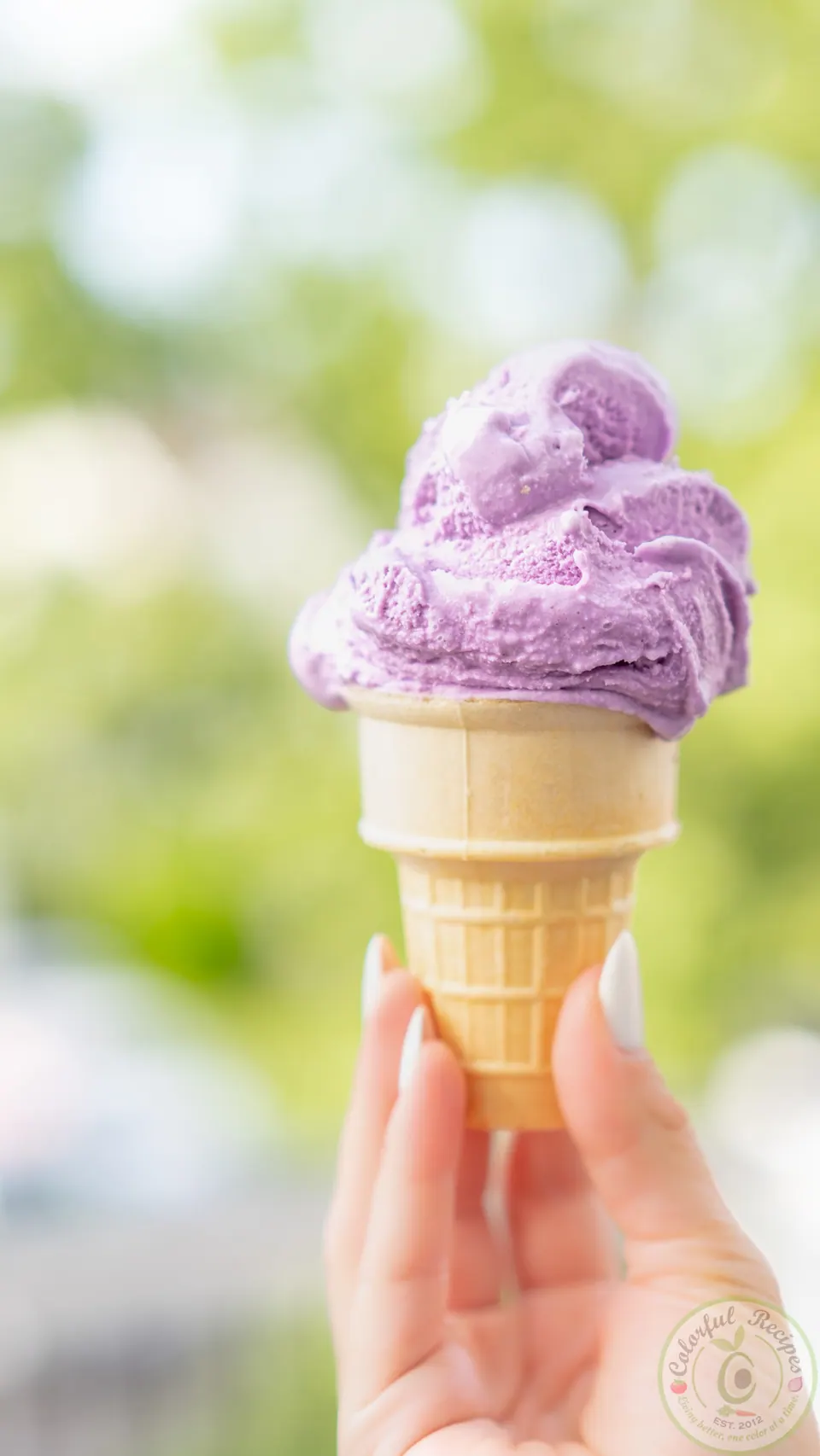 Scoops of purple ube vanilla ice cream in a bowl