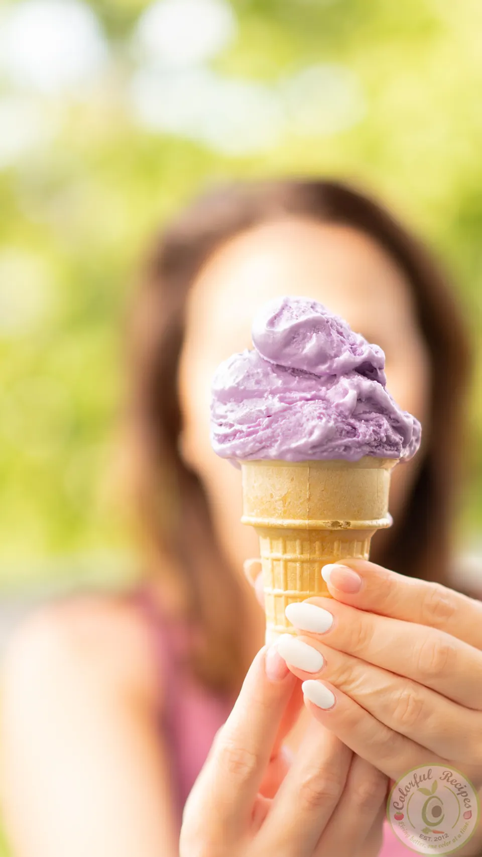 Homemade ube vanilla ice cream in a freezer container