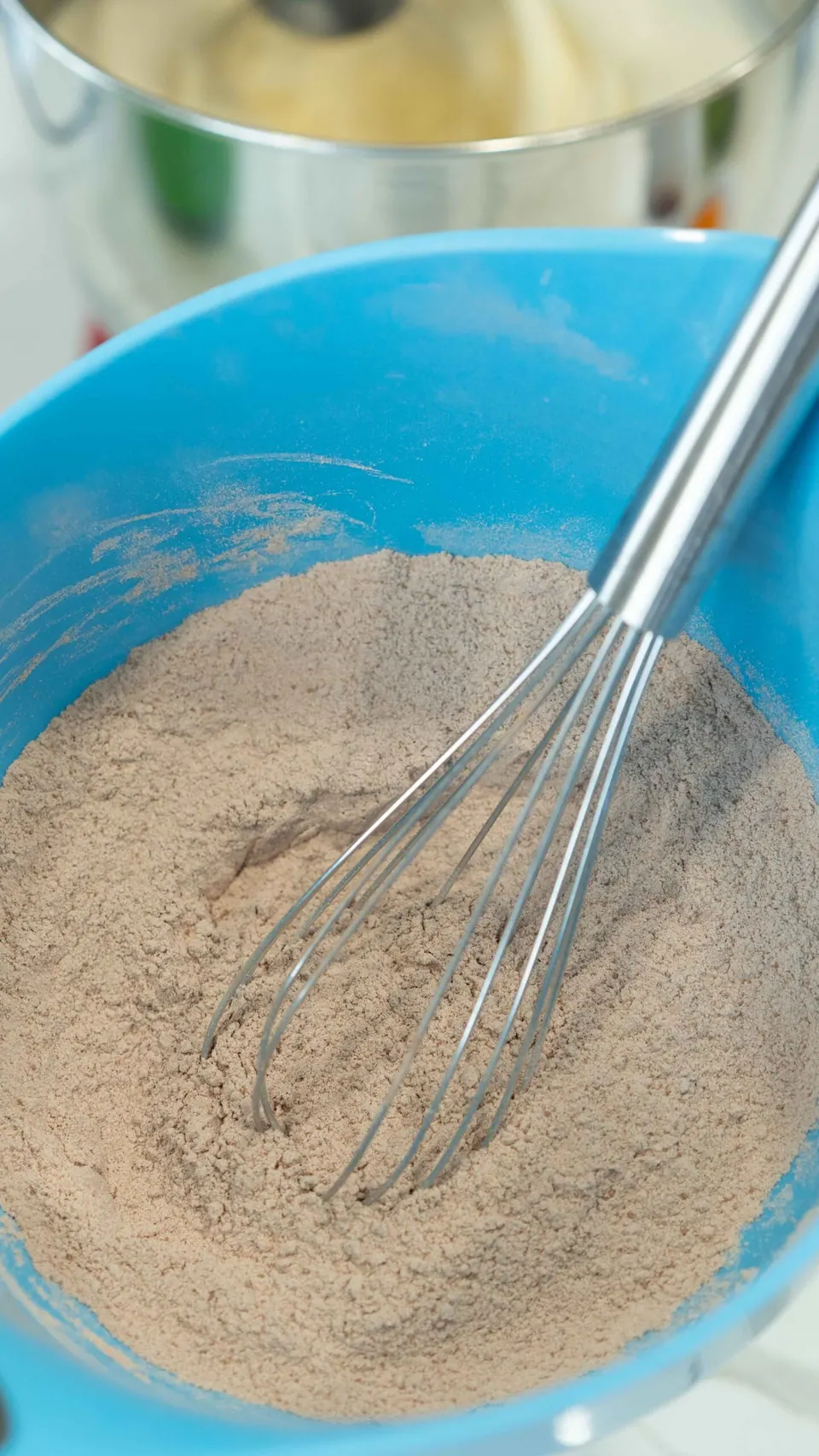 Whisking the flour and cocoa mixture for the Bûche de Noël sponge
