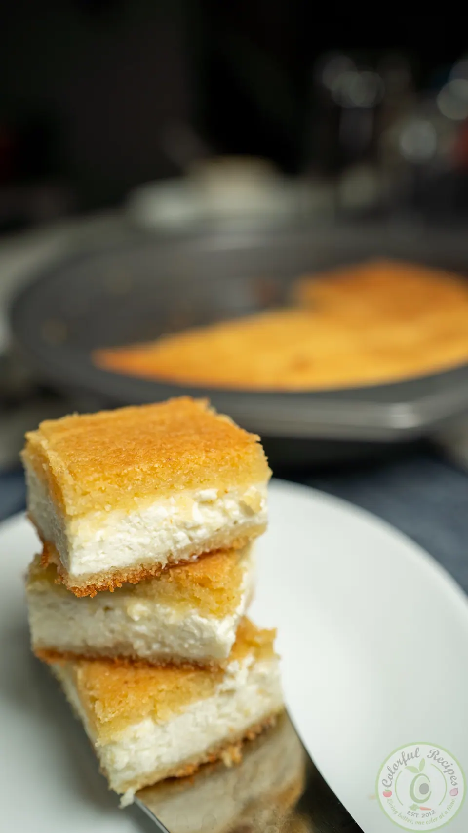 Stacked squares of Maamoul Mad bi Ashta showing the creamy ashta layer