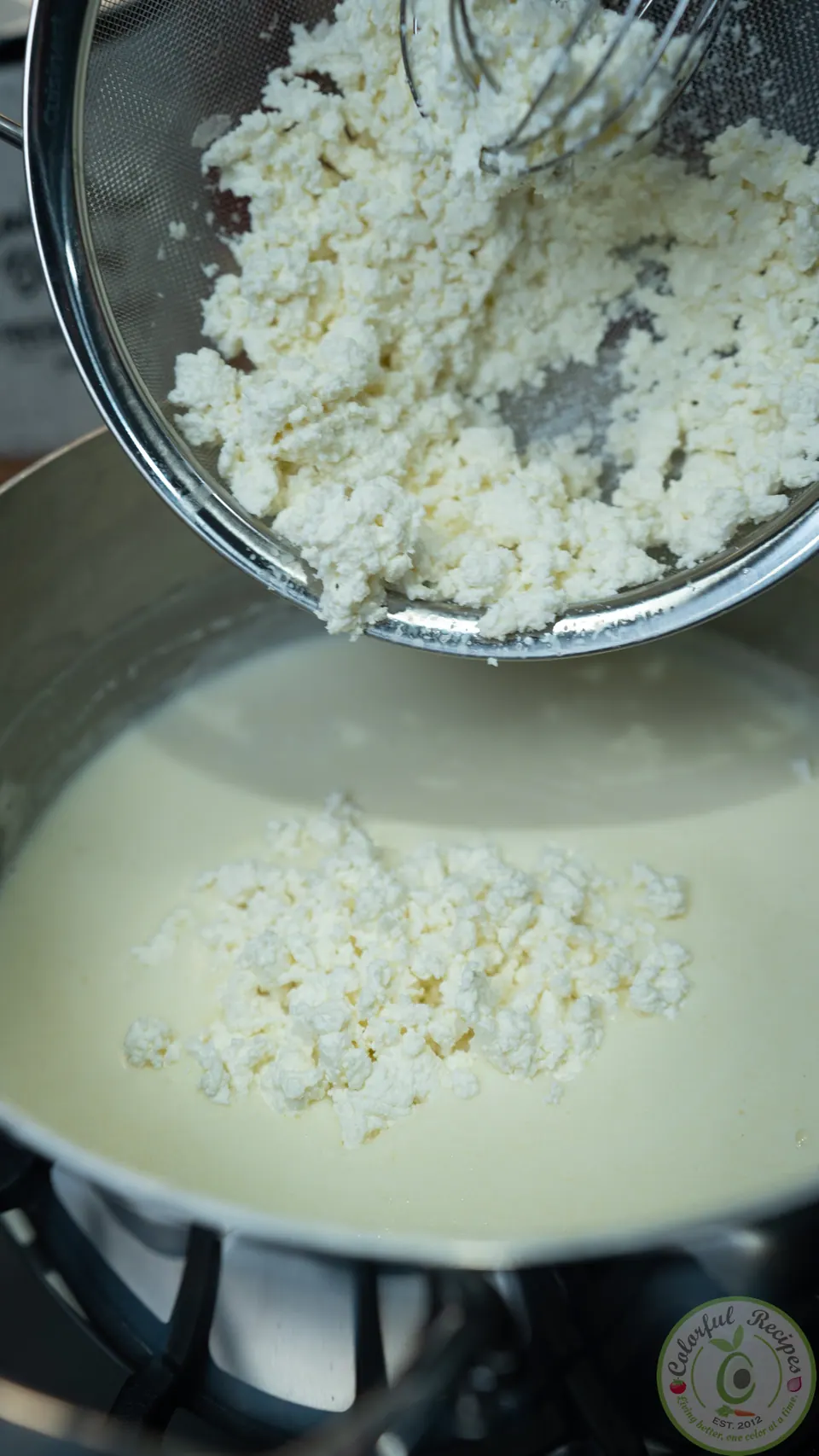 Adding clotted ashta curds to the ashta cream