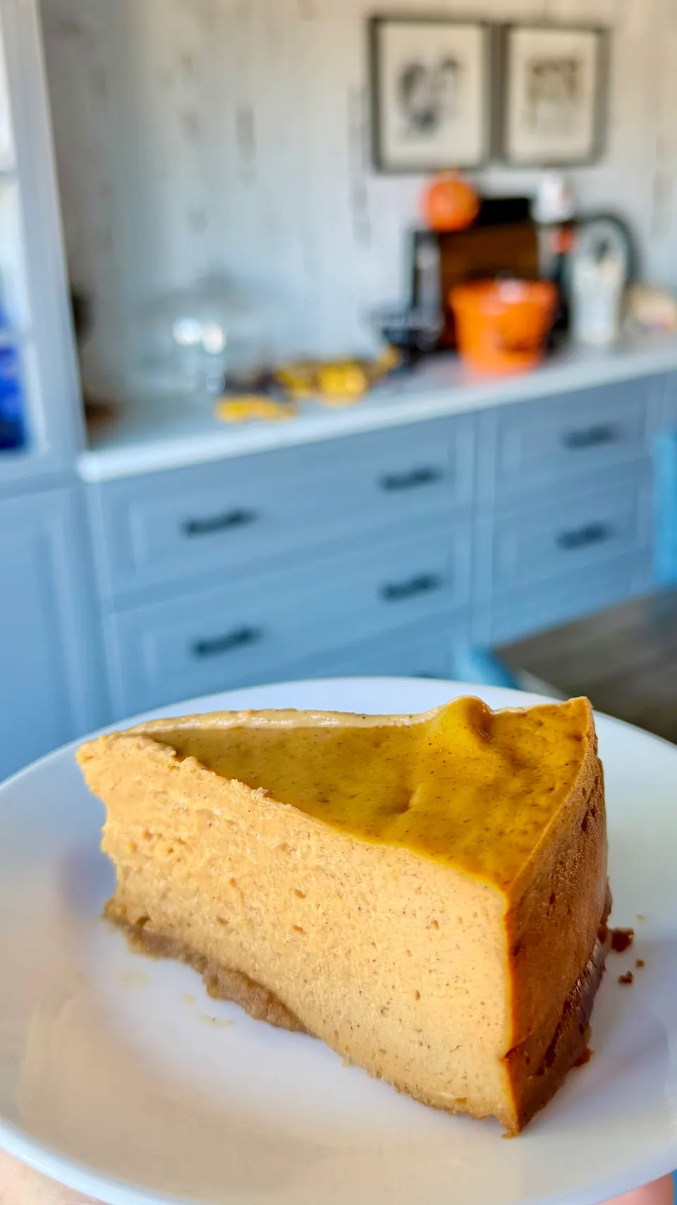 Slice of 9-inch high-protein cottage cheese pumpkin pie on a white plate