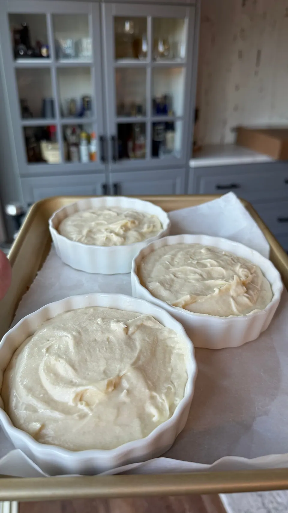Bourbon butter cake batter divided evenly among fluted ramekins